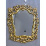 A Rococo style mirror, hand carved gilded frame with floral motives, 20th century, 85 x 70 cm