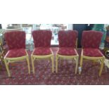 A set of four Art Deco burr walnut dining chairs, with red floral upholstery, on square legs
