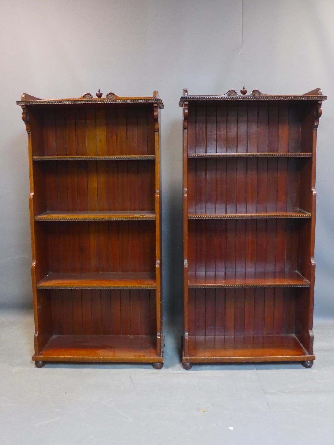 A pair of Victorian walnut open waterfall bookcases with egg and dart edges, having floral carving - Image 2 of 3