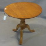 An early 20th century mahogany tilt top occasional table, the circular top on baluster turned