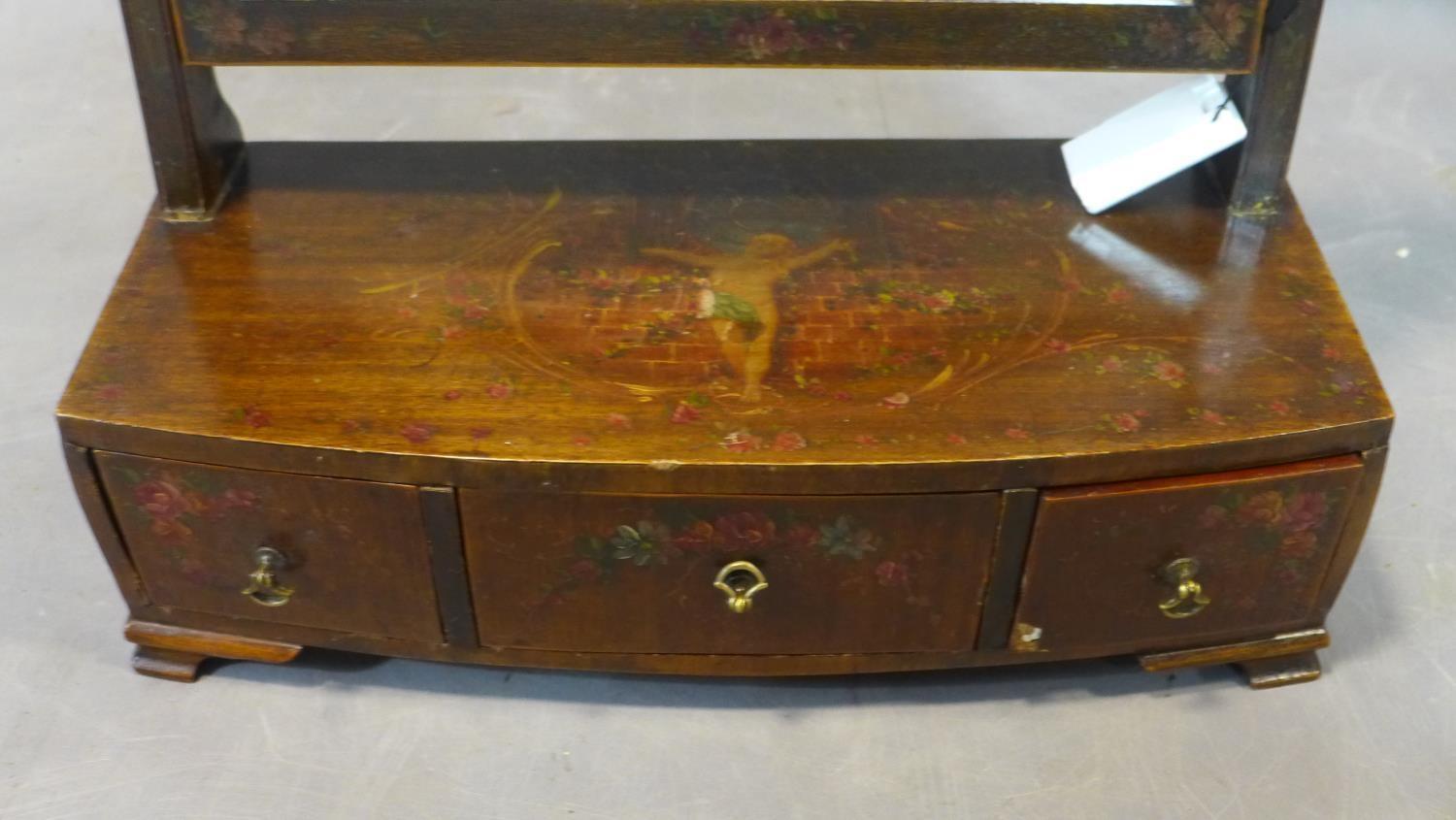 A toilet mirror painted with cherub and flowers, having three drawers, raised on bracket feet, H. - Image 2 of 3