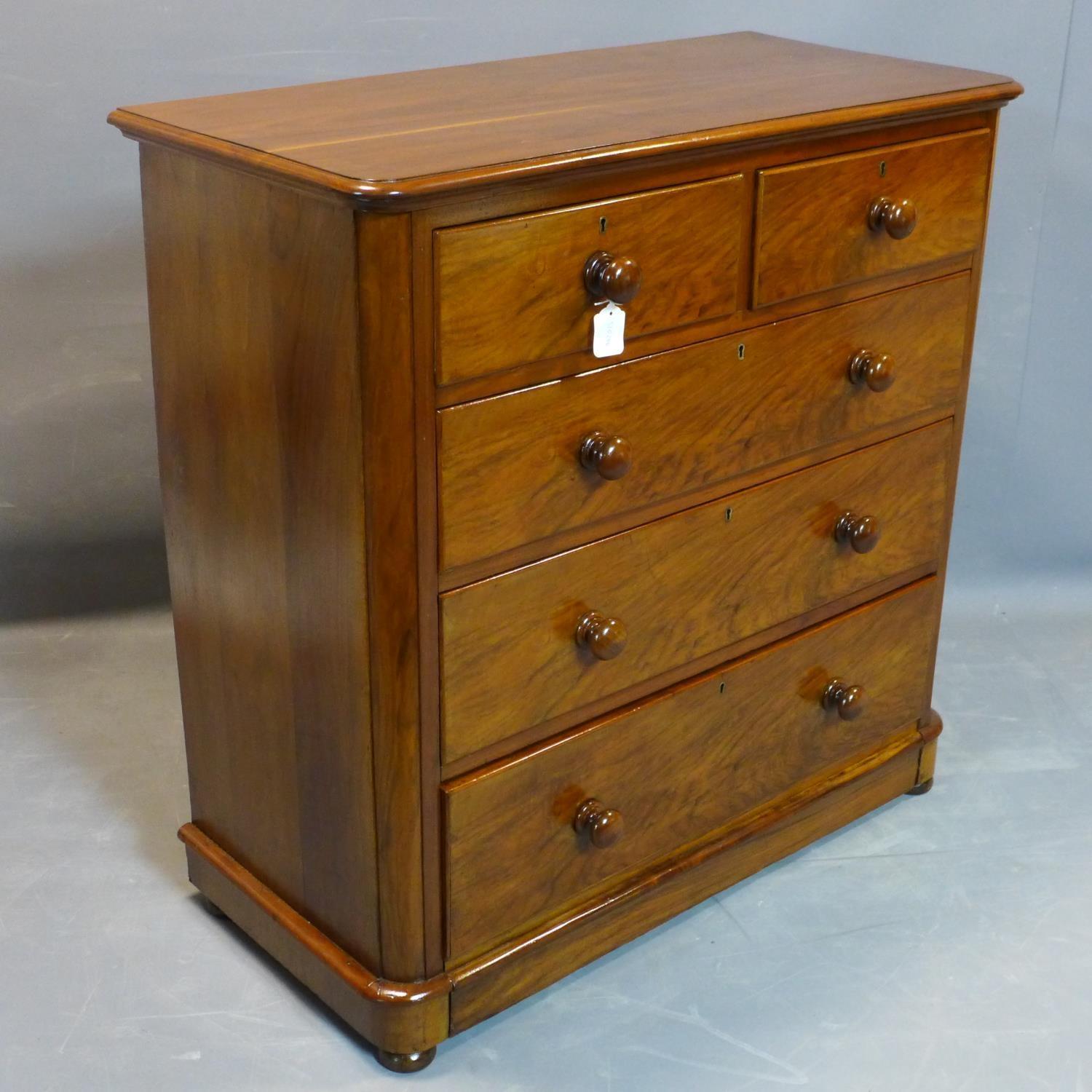 A Victorian walnut chest of two short over three long drawers, on pedestal base and bun feet, H. - Image 2 of 2