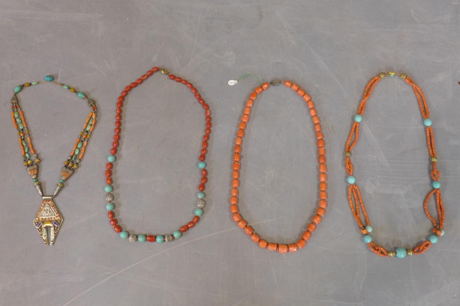 Three necklaces to include a coral beaded necklace, a turquoise and coral necklace, a turquoise,