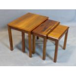 A nest of three Danish exotic hardwood tables, marked 'Made in Denmark' to bases, H.46 W.54 D.39cm