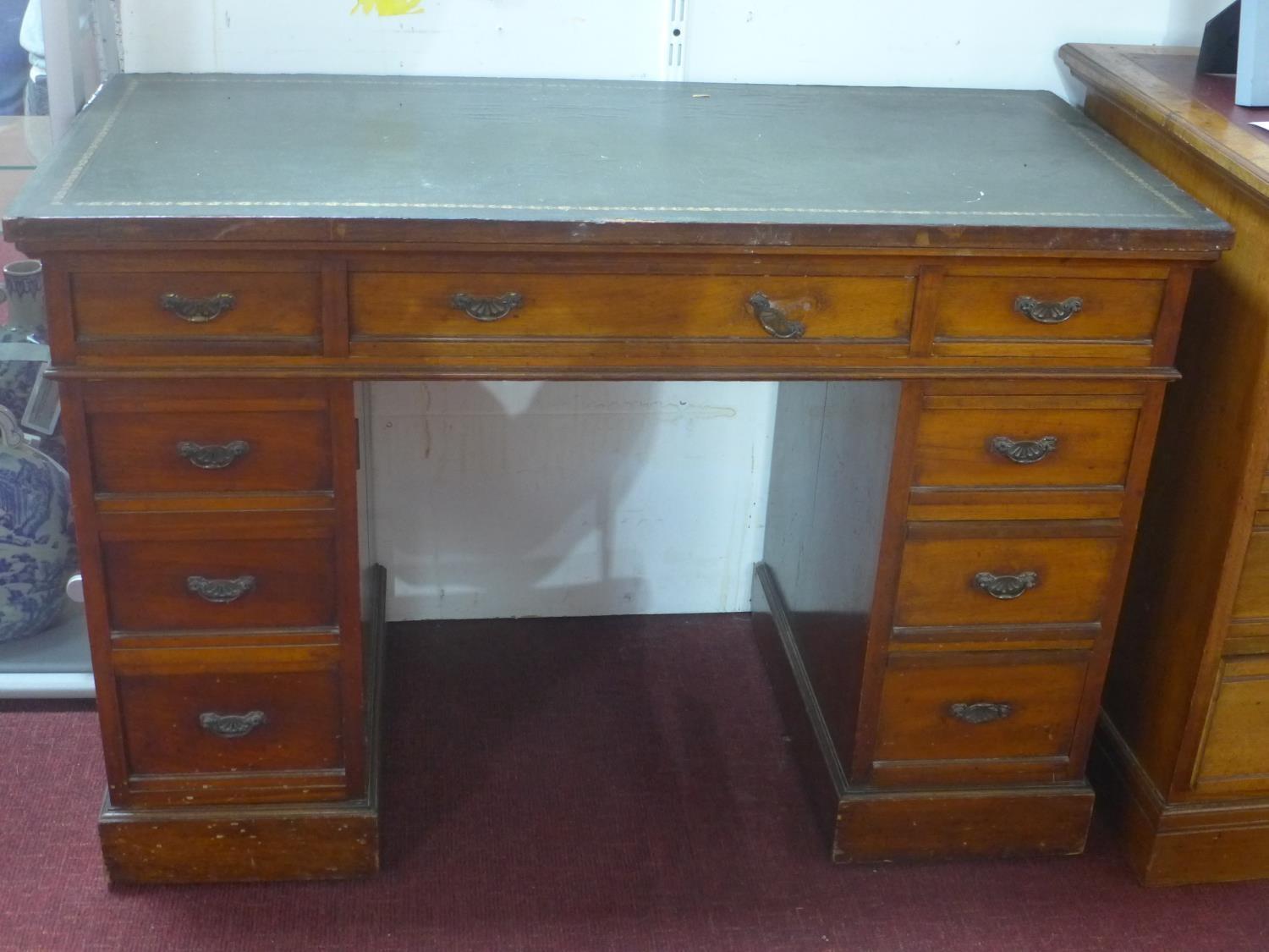 A Victorian mahogany pedestal desk, having an arrangement of nine drawers, on pedestal base, H.72