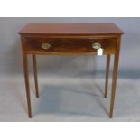 A 19th century mahogany bow fronted side table, with single drawer, on square tapered legs, H.76 W.