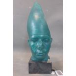 A turquoise cast plaster Egyptian style head, indistinctly signed to reverse, on faux marble cast