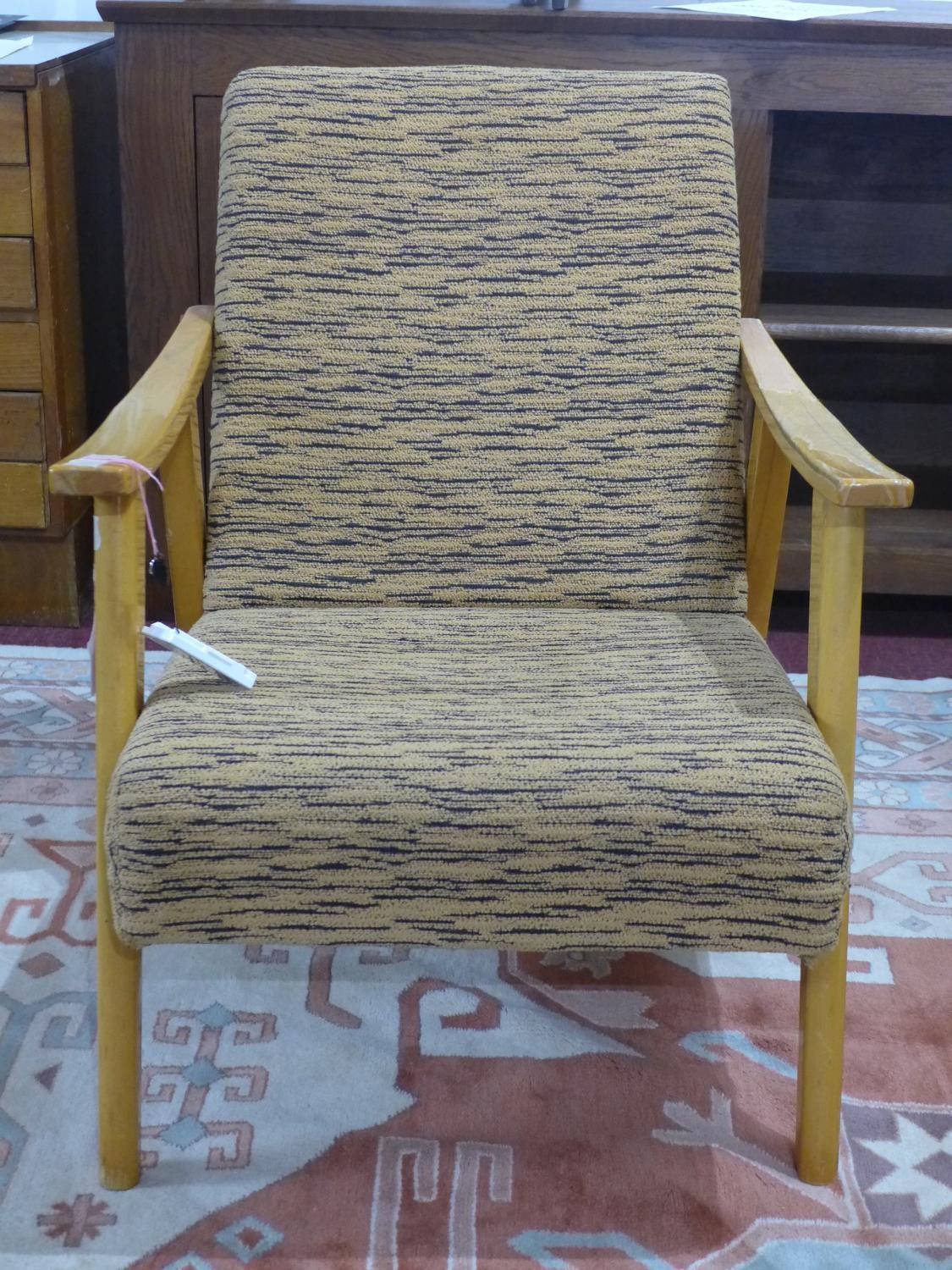 A retro armchair with striped orange upholstery, H. 80 x W. 60 x D. 65 cm