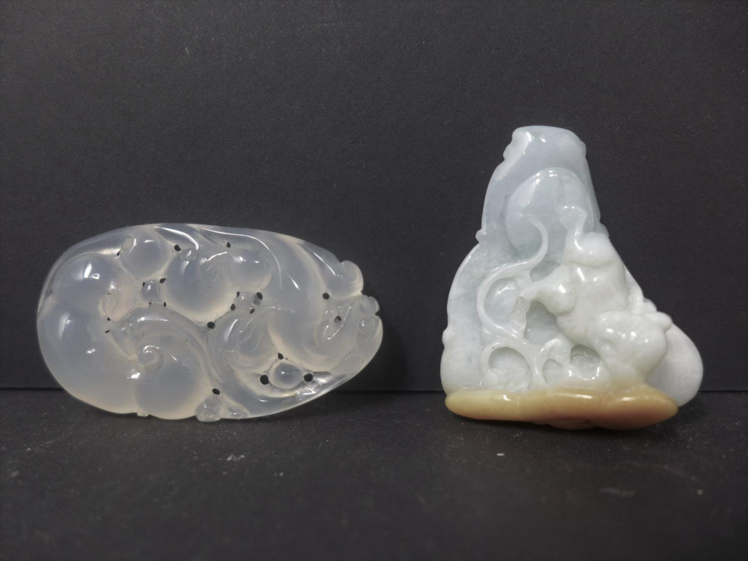 A Chinese jadeite pendant carved with a Dog of Fo, H.4.5 W.3.8cm, together with a Chinese agate