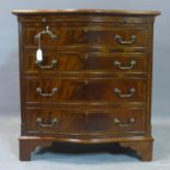 A serpertine fronted figured mahogany Bachelor's chest, with cross-banded top above brush slide