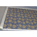 A roll of designer fabric with gilt leaf decoration on a blue ground, marked 'Jane Churchill