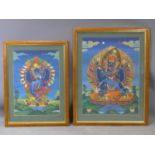 Two Nepalese paintings on silk of Hindu deities in mandorlas, in walnut veneered frames (chips to