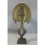 A Central African tribal Kota reliquary figure, Gabon, brass and wood, on stand, H.56cm (figure)