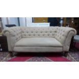 A Chesterfield sofa with button back upholstery, on turned legs, H.70 W.165 D.88cm