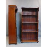 A pair of Victorian walnut open waterfall bookcases with egg and dart edges, having floral carving
