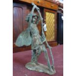 A cast iron fairy in the verdigris finish, on a naturalistic base, H.61cm