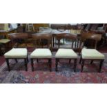 A set of four mahogany William IV dining chairs, with cream upholstered seats, on turned legs, label