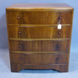 A walnut bowfronted chest of four drawers, on bracket feet, H.85 W.76 D.48cm