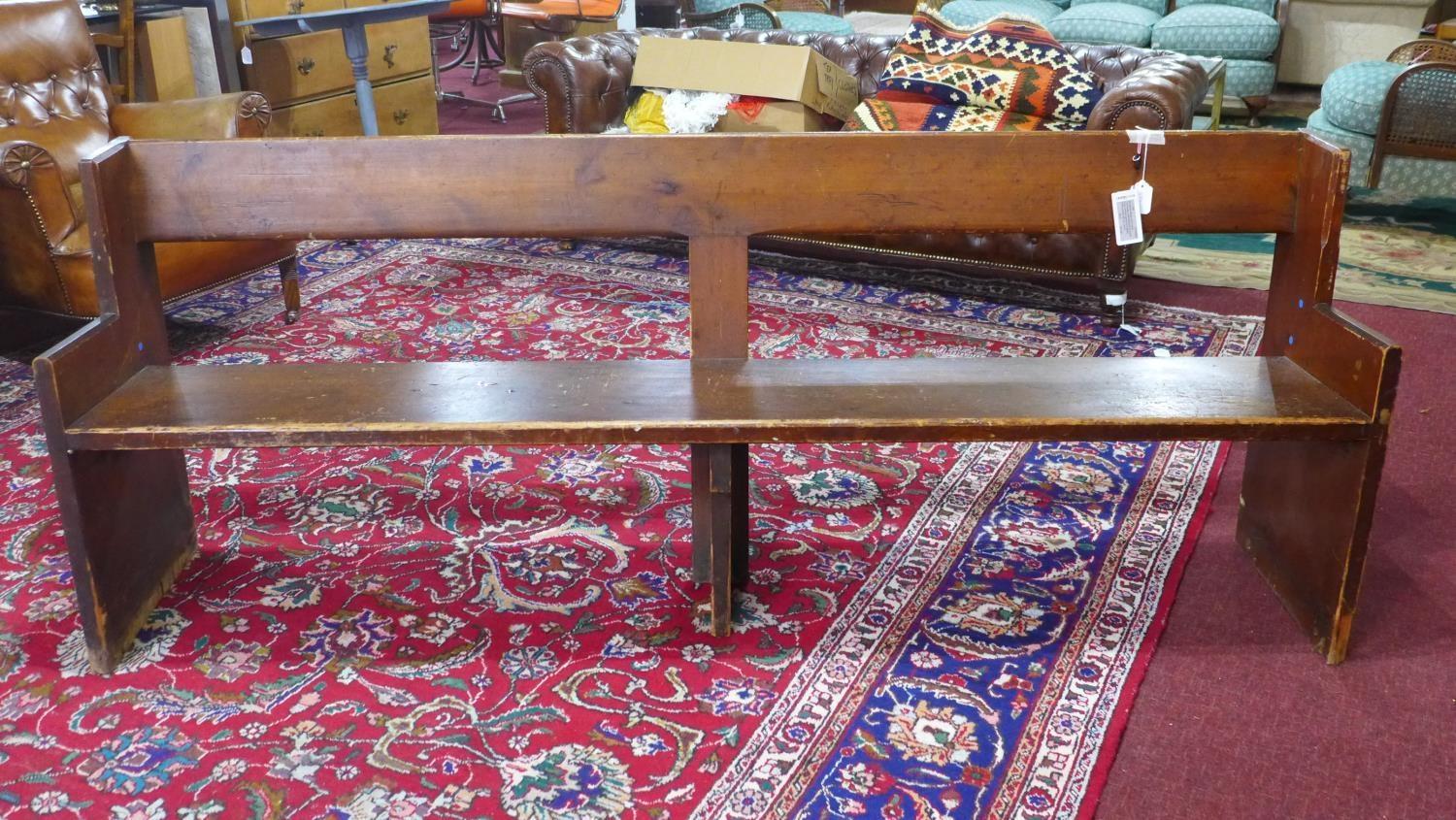 A 20th century pitch pine church pew, H.78 W.204 D.42cm