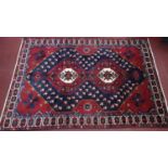 A North West Persian Bakhtiari carpet, double pole medallion with repeating petal motifs on a