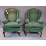 A pair of Peter Dudgeon wingback armchairs, with green upholstery, on cabriole feet, H.110 W.70cm