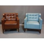 Two leather armchairs, one in light blue leather, the other brown leather, on tapered legs, each