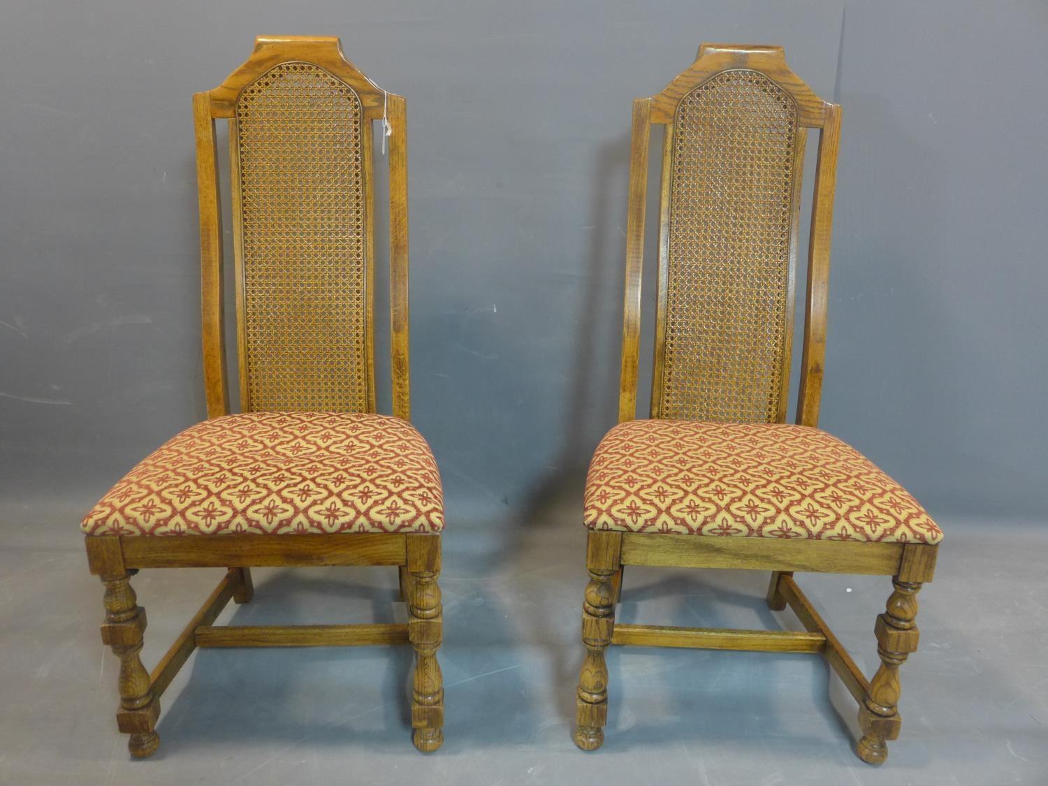 A set of eight fruitwood dining chairs with caned rattan back rests, having floral upholstered - Image 2 of 3