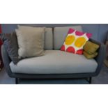 A small two seater sofa by Habitat on splayed tapering supports