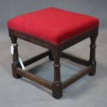 A 19th century country oak stretchered stool