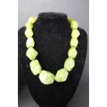 Bold multi strand green jade necklace with a asymmetrical large faceted beads