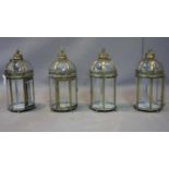 A set of four Georgian Style gilt lanterns, each h. 37 cm