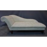 A Victorian style chaise longue in ivory buttoned upholstery