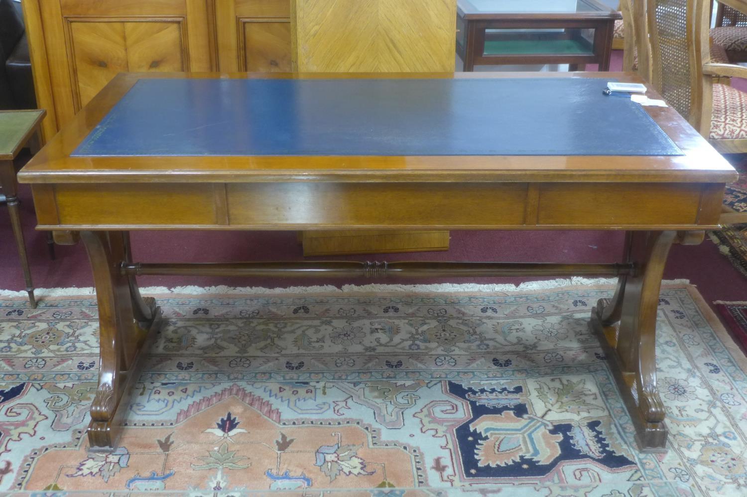 A 19th century mahogany library table, with scrolling supports, having blue leather skiver above two - Image 2 of 3