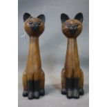 Two carved contemporary wooden cats