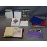 A collection of International stamps, in albums, together with a collection of Year Packs of Mint