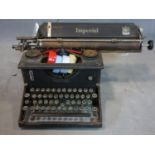 A vintage Typewriter Imperial George the 5th with a collection of Ribbons.