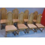 A set of eight fruitwood dining chairs with caned rattan back rests, having floral upholstered