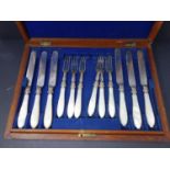A 19th century boxed set of silver plate and mother of pearl and bone handled cutlery