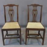 A pair of Edwardian Hepplewhite style mahogany dining chairs, with shaped back splats and shaped top