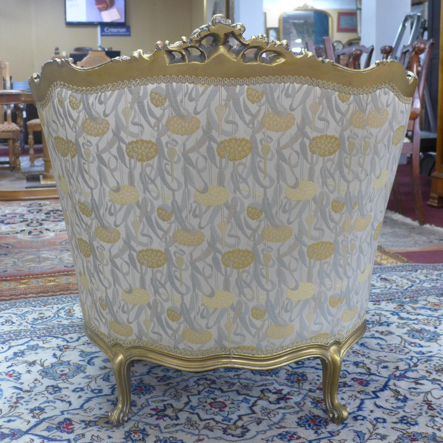 A pair of giltwood armchairs, with elaborate c-scroll and floral carved giltwood frames, on c-scroll - Image 4 of 7