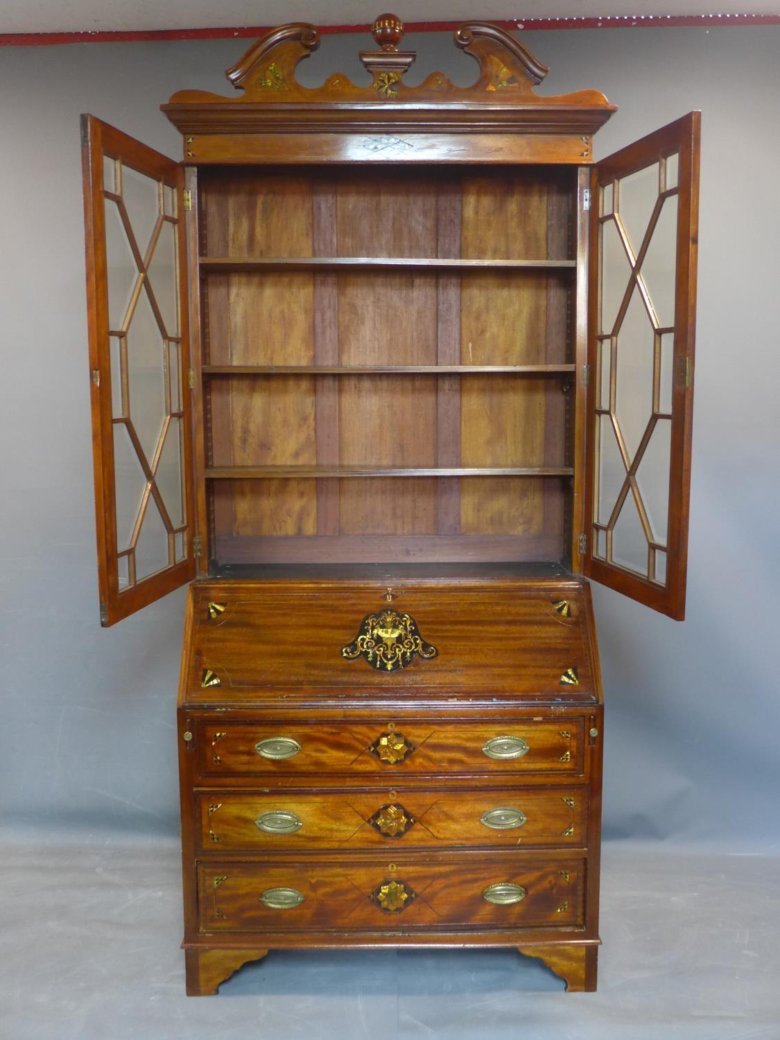 A 19th century inlaid mahogany bureau bookcase, the broken arch pediment above two astragal glazed - Image 4 of 5