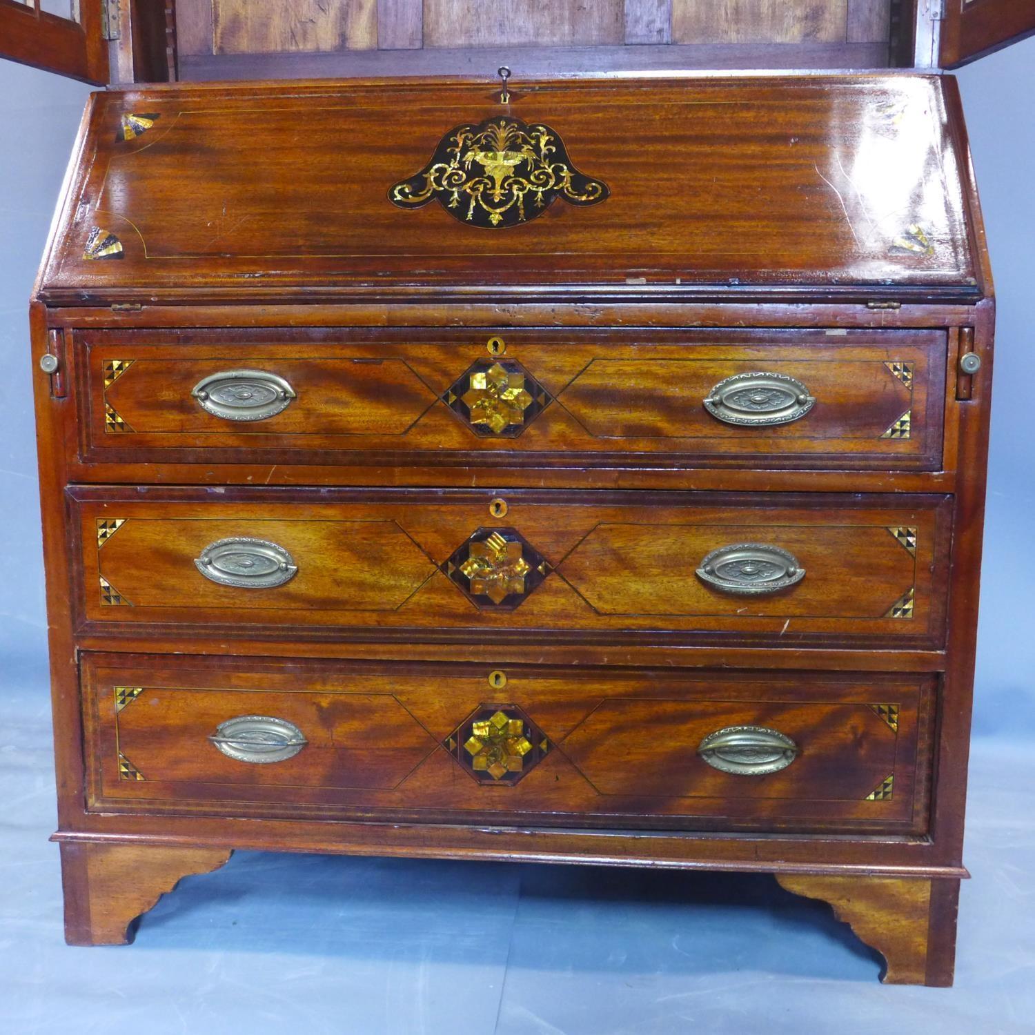 A 19th century inlaid mahogany bureau bookcase, the broken arch pediment above two astragal glazed - Image 5 of 5