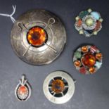 A collection of Celtic design brooches, to include semi-precious stone set example (4)
