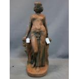 A terracotta figure of a early 20th century belly dancer, H. 83 cm