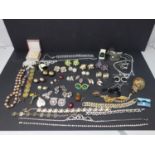 A mixed collection of costume jewellery, to include necklaces, brooches, earrings etc.