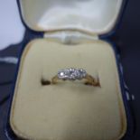 An 18ct gold, platinum and diamond ring, with 9ct gold resizing band, boxed