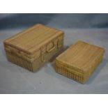 Two large rattan and wicker suitcases or osier valises.