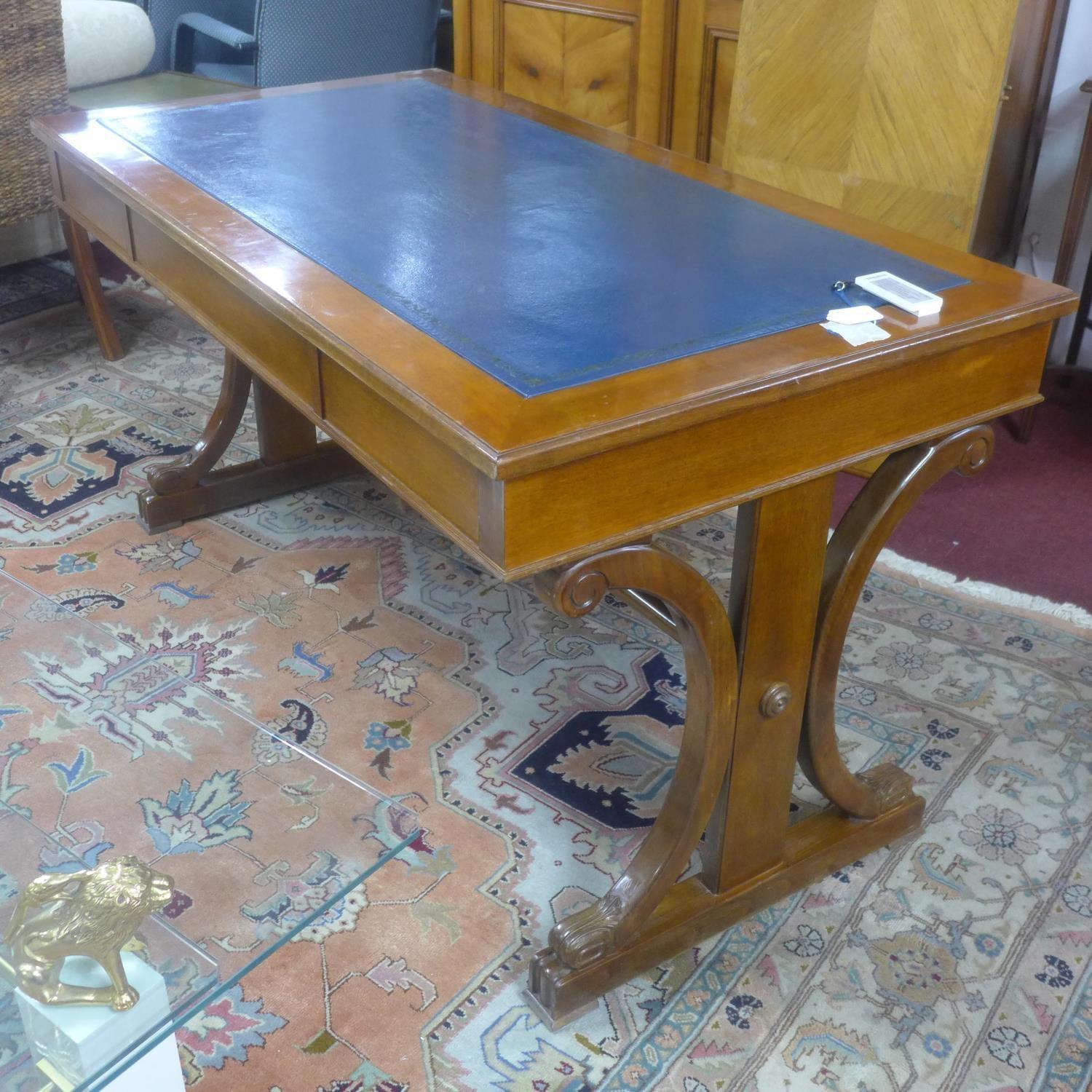 A 19th century mahogany library table, with scrolling supports, having blue leather skiver above two - Image 3 of 3