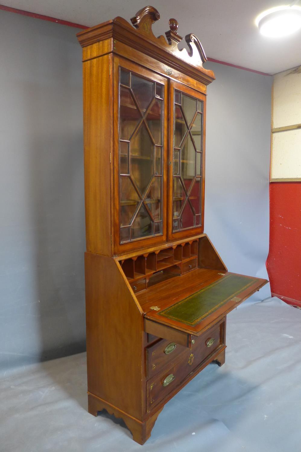 A 19th century inlaid mahogany bureau bookcase, the broken arch pediment above two astragal glazed - Image 2 of 5