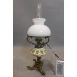 A late 19th century Continental oil lamp, with glass shades, crackle glaze bowl to centre and bras